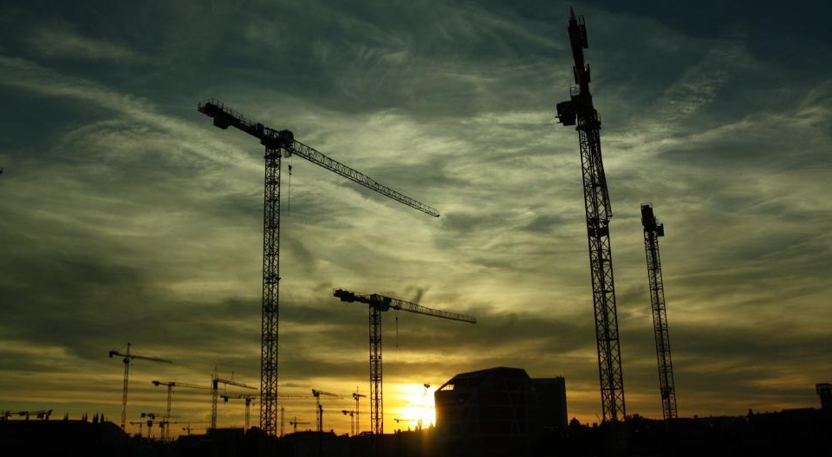 Cranes on construction site at night