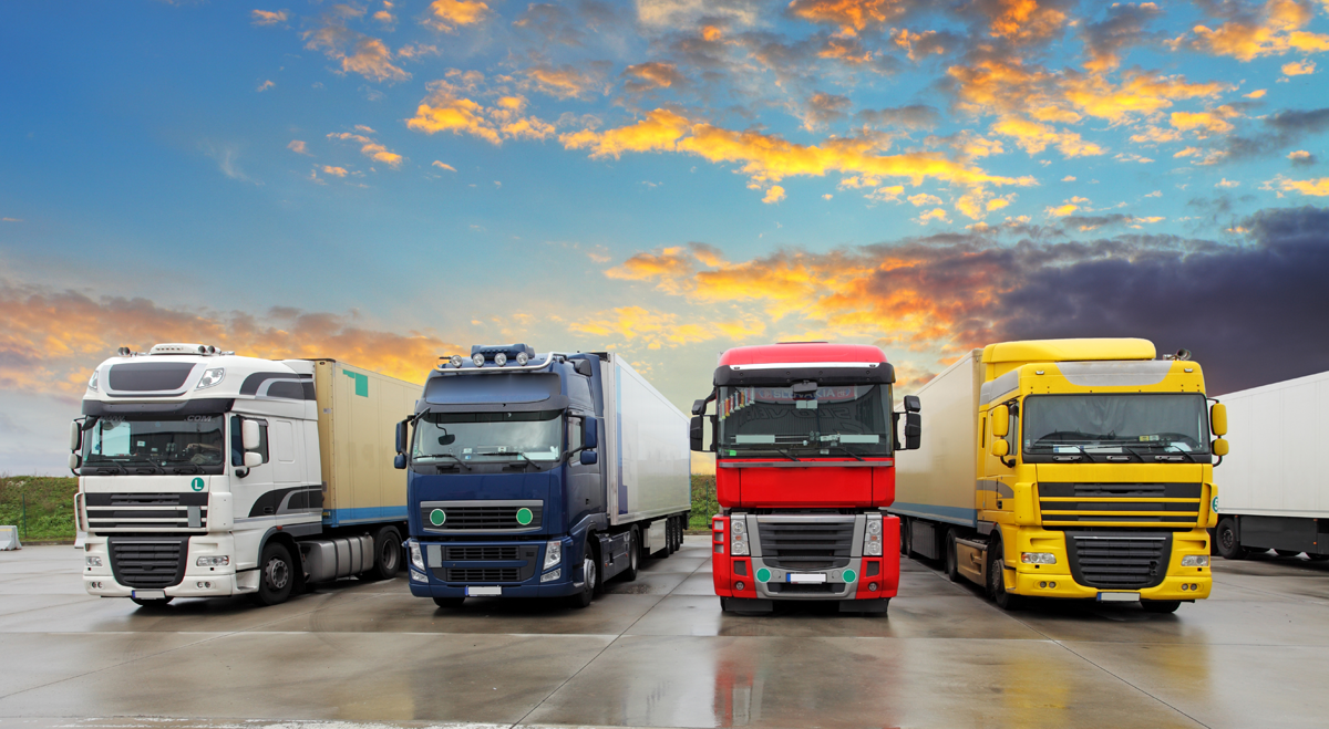 Four lorries parked in a row