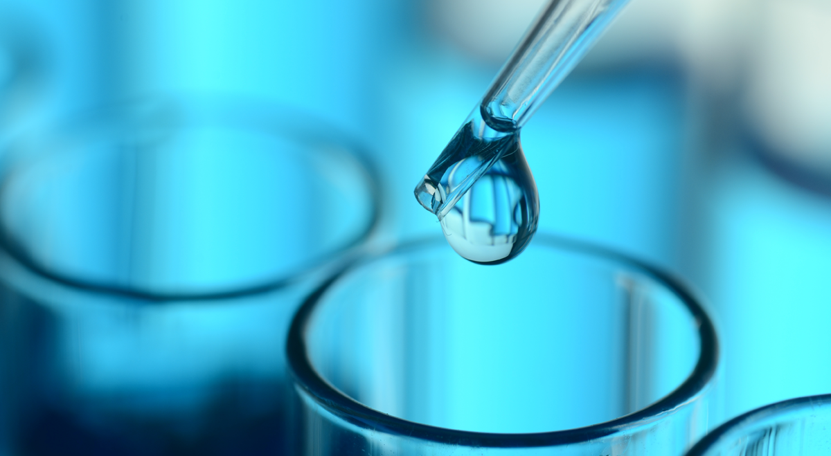 Pipette dropping liquid into a test tube