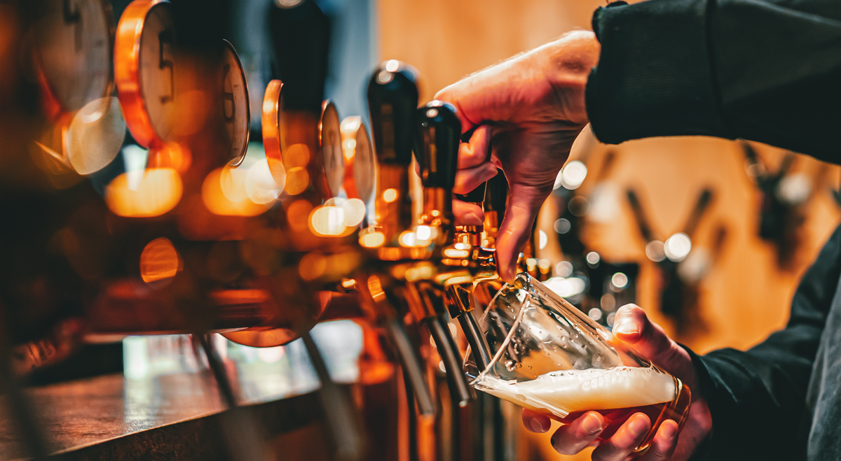 Beer being poured in a pub