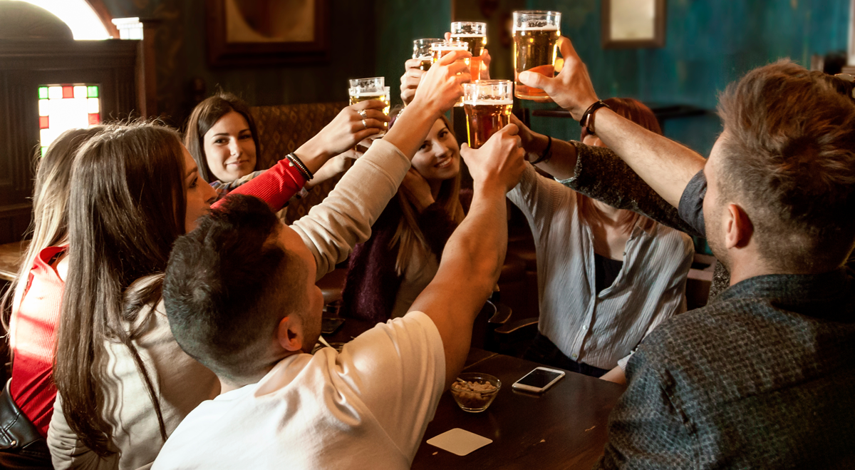 People drinking beer in a pub
