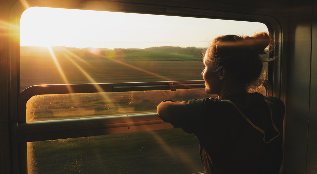 Woman looking out of train window