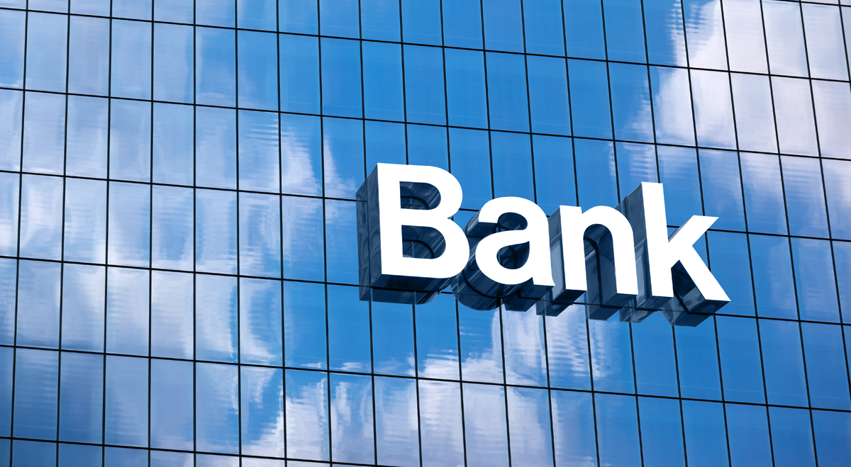 Bank sign on glass building