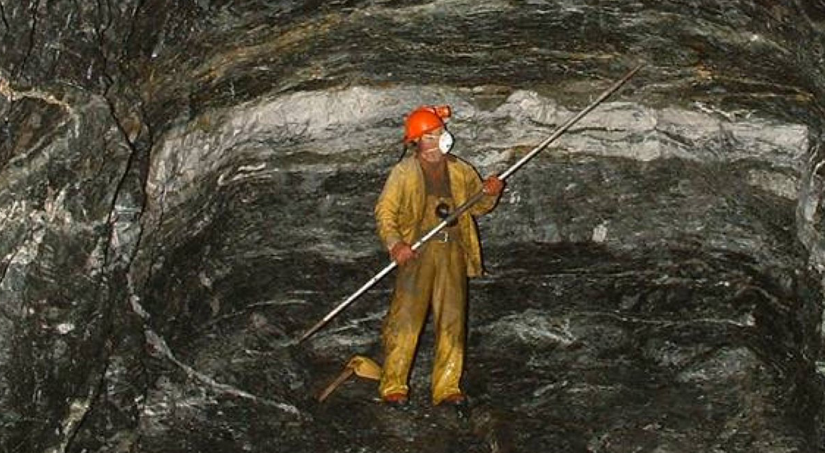 Miner in gold mine