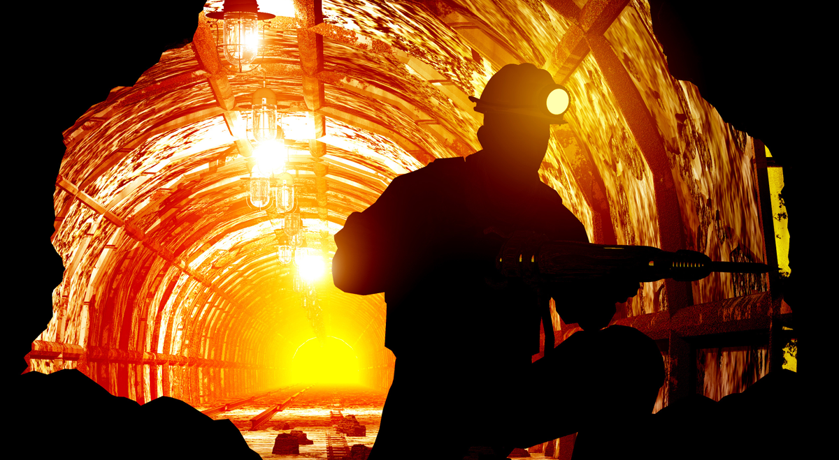 Miner drilling underground