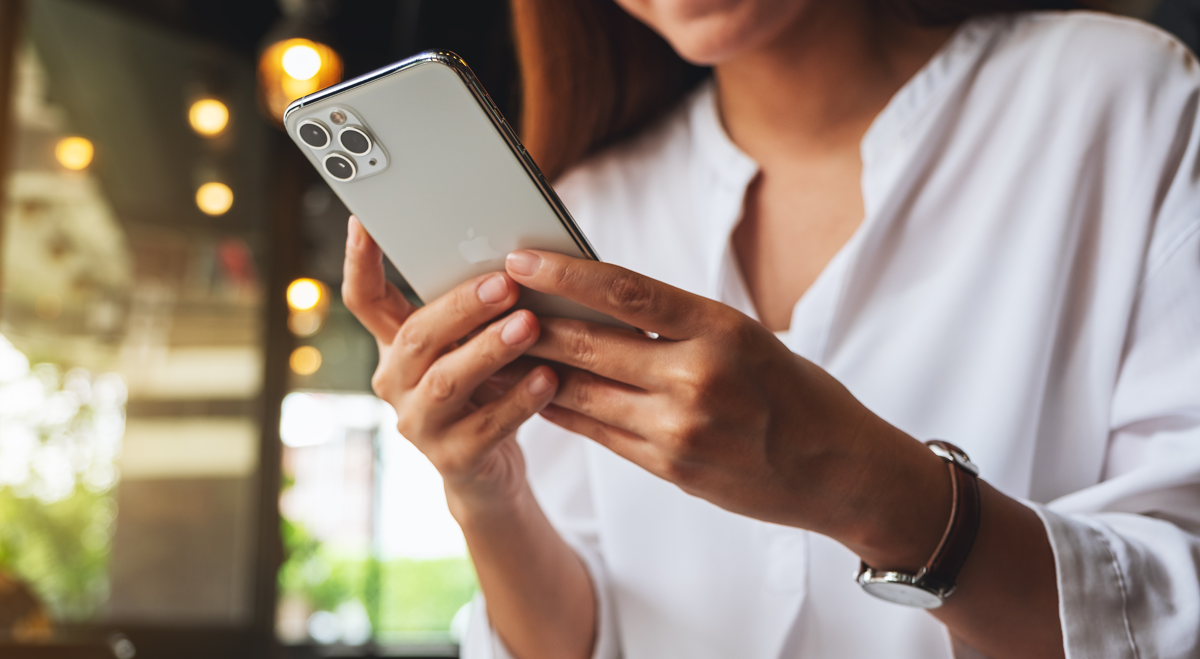 Woman holding Apple iPhone